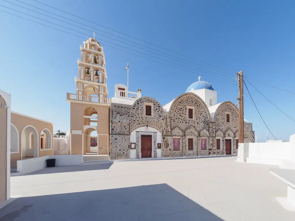 The stone church of Saint Demetrius with its bell tower and blue dome on a white square in Messaria