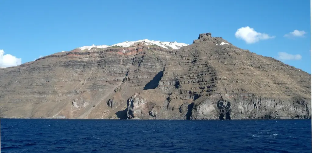 Skaros Rock jutting from the caldera cliff below the white houses of Imerovigli