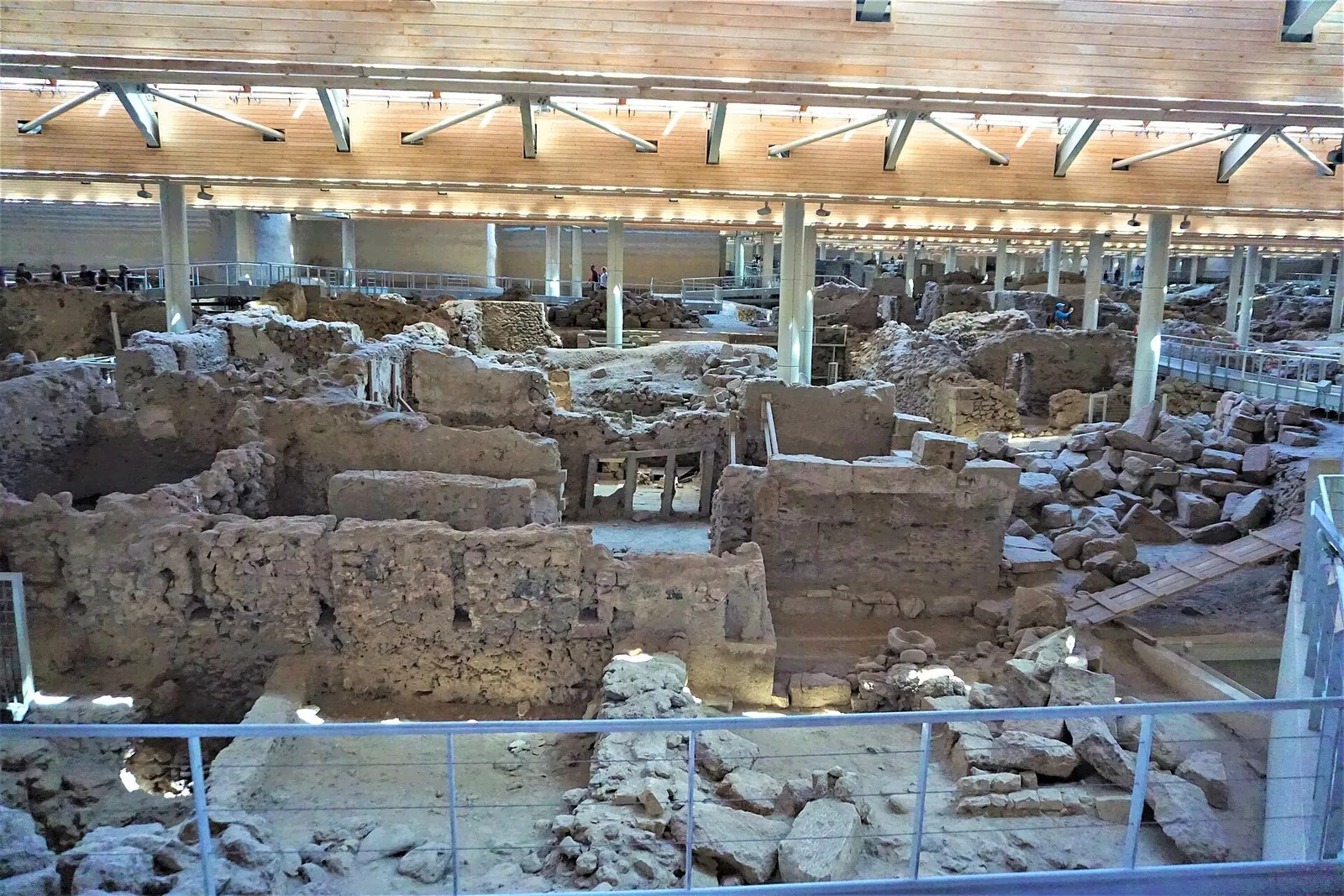 Excavated Bronze Age streets and houses at Akrotiri under the modern roof, the core site of Santorini history